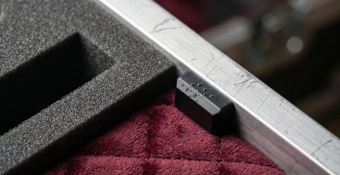 Extreme close-up macro detail of professional climate-controlled instrument case interior showing humidity control technology and custom foam protection