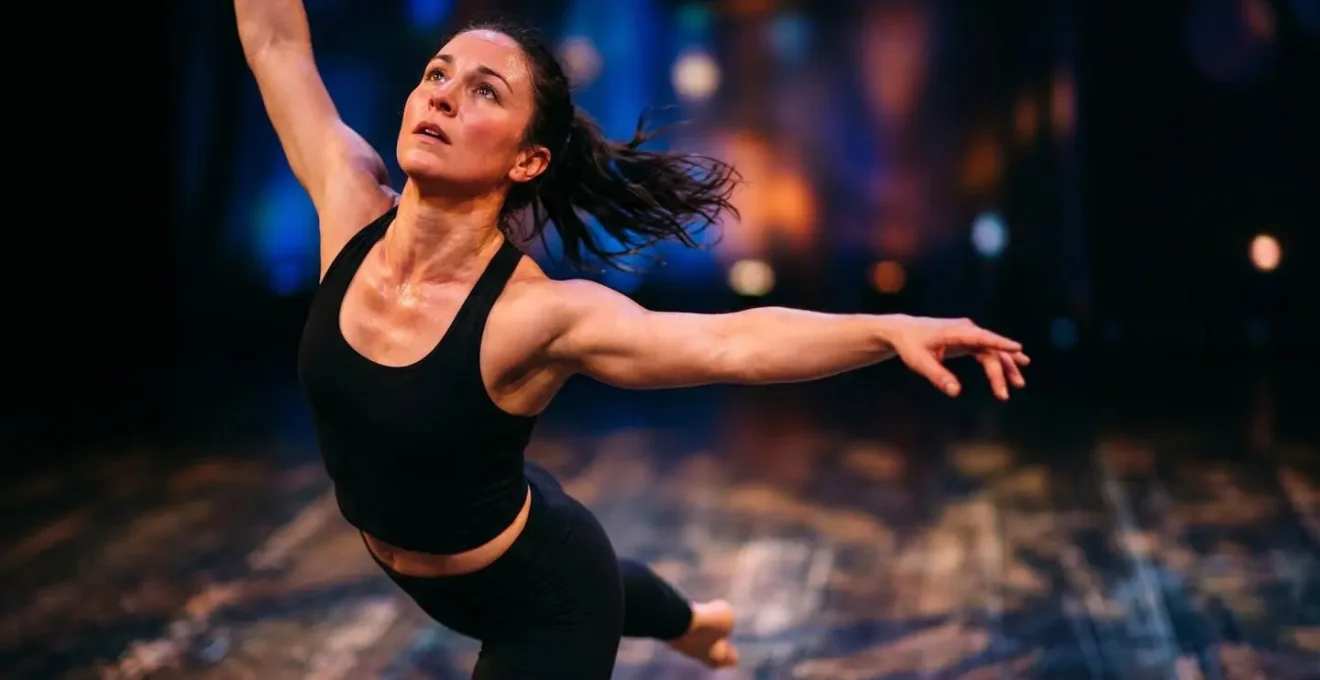 Solo dancer mid-performance showing dynamic movement and stamina