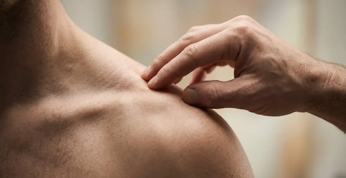Close-up of hands performing precise therapeutic bodywork demonstrating kinesthetic expertise