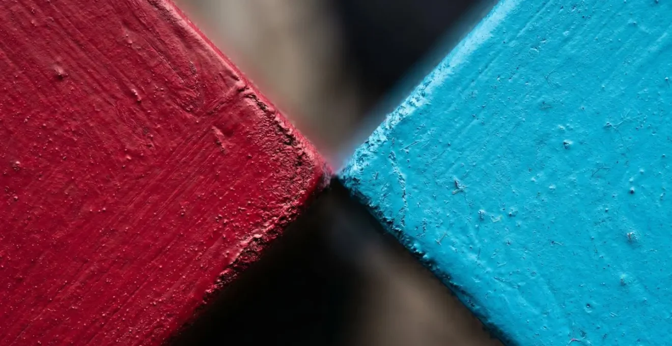Extreme close-up of contrasting color surfaces creating visual tension and perceptual compression