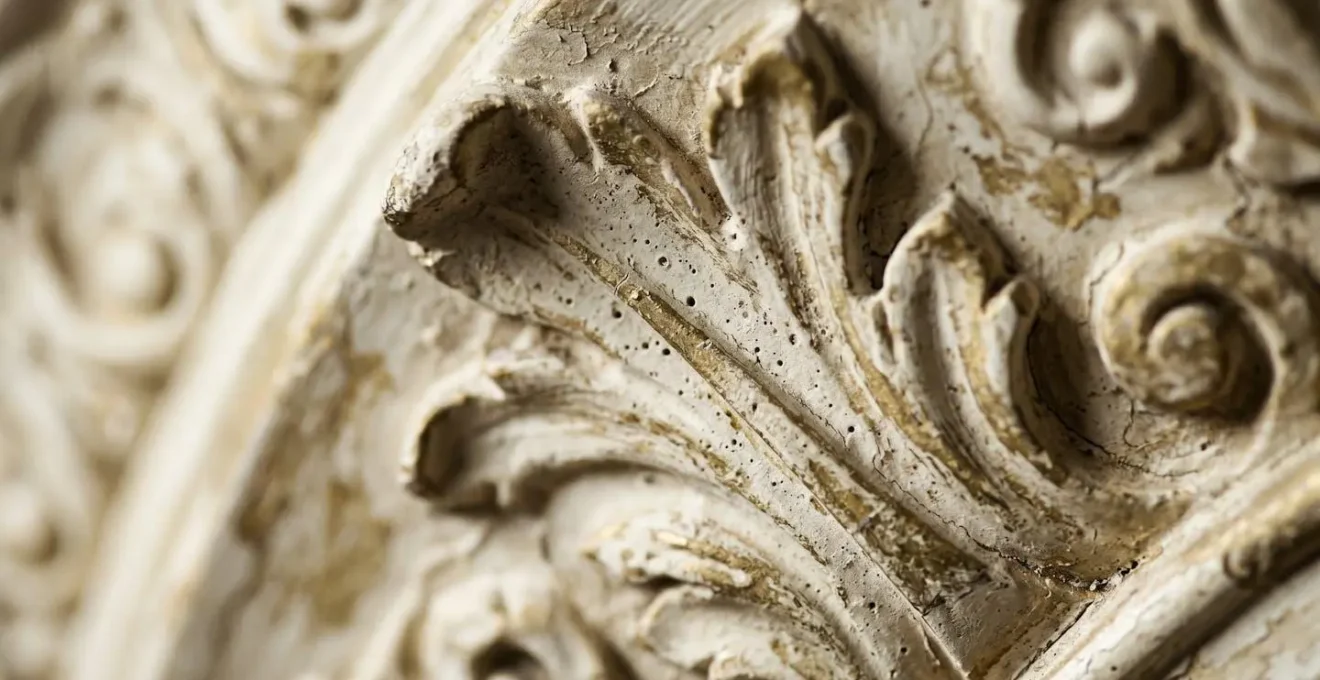 Extreme close-up of ornate Georgian plaster molding showing texture and craftsmanship